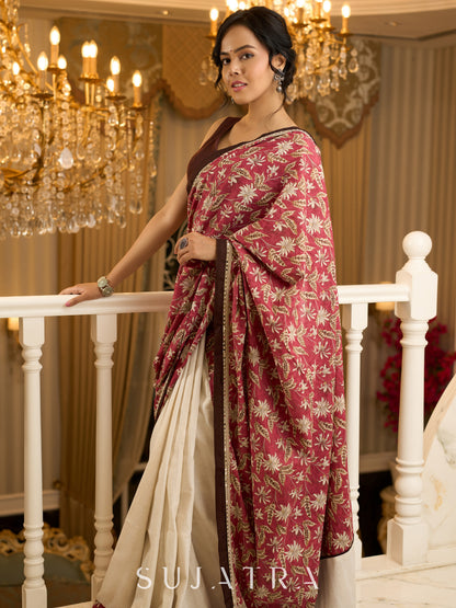 Ivory elegance meets rich pink florals in this exclusive cotton saree