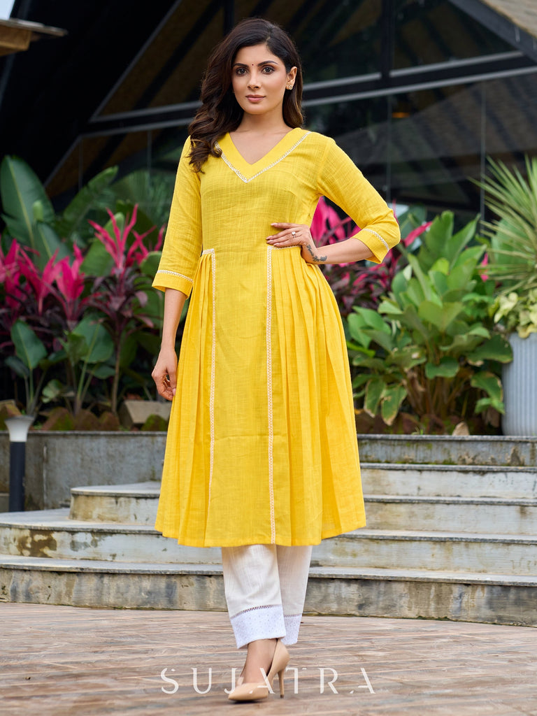 Lemon yellow pleated kurta accented with delicate lace detailing-pant optional