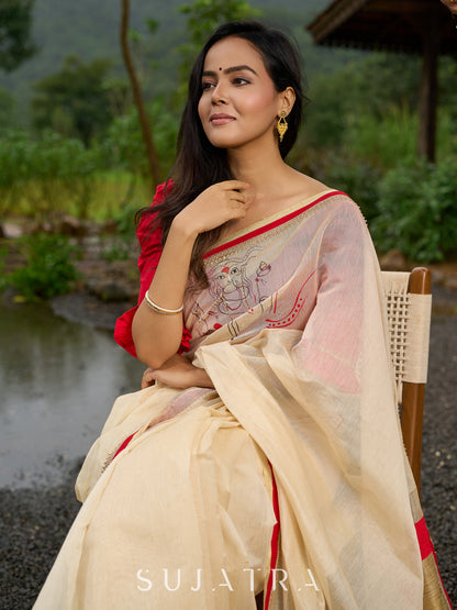 Elegant cream chanderi saree with subtle red border, featuring hand-painted Durga art