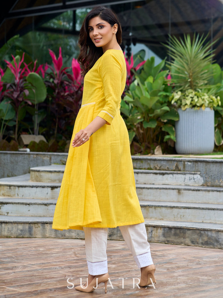 Lemon yellow pleated kurta accented with delicate lace detailing-pant optional