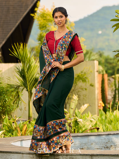 Classic Bottle Green Georgette Saree with Kalamkari Border Detailing & Ajrakh Highlight