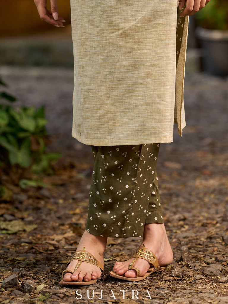 timeless cream kurta enhanced with handcrafted olive bandhani elements.