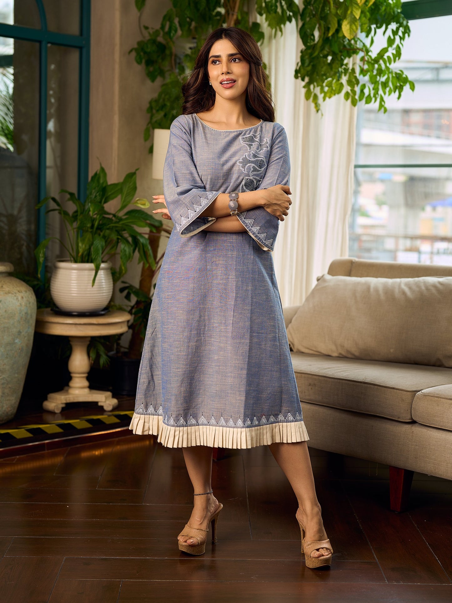 Two-tone handloom cotton dress with delicately painted Madhubani fish motifs and pleated hem.
