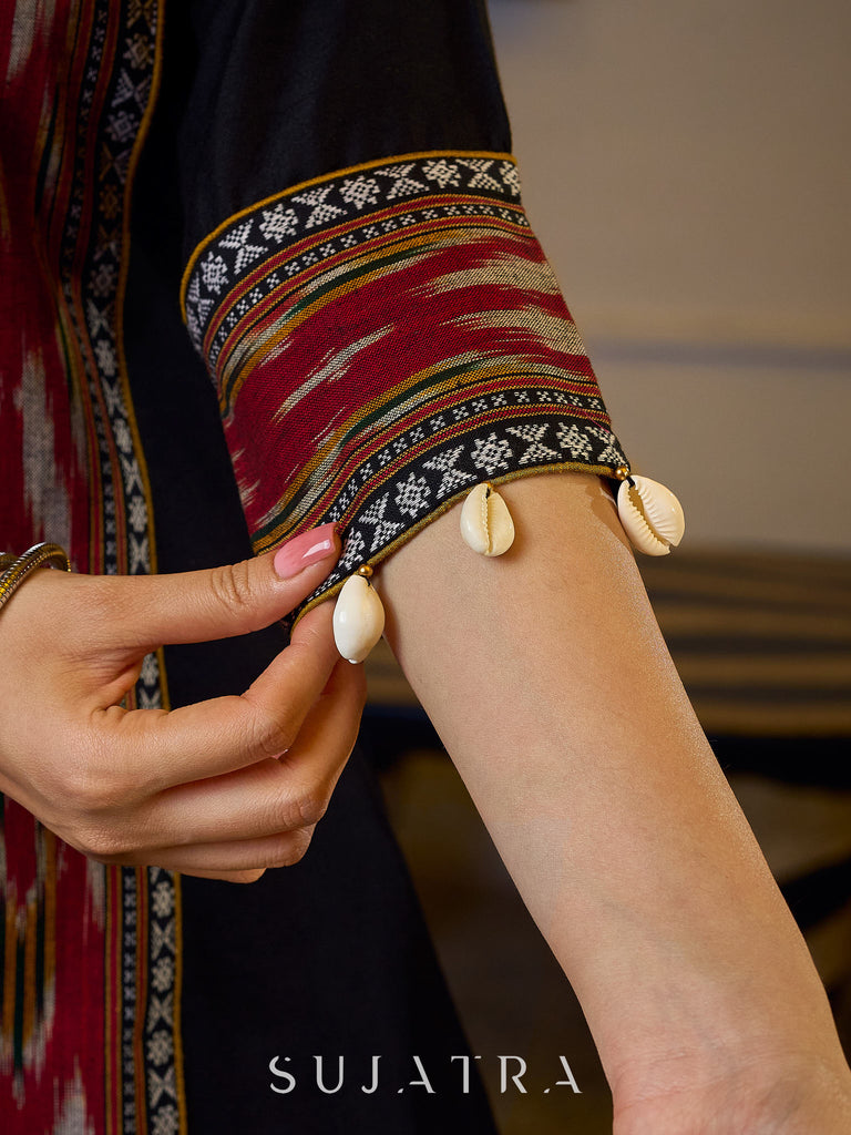 Sleek Black Cotton Silk Top Adorned with Ikat Borders and Exquisite Cowrie Embellishments