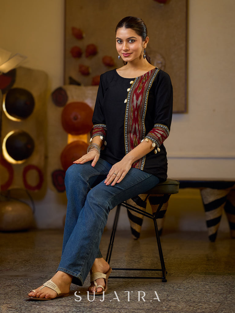 Sleek Black Cotton Silk Top Adorned with Ikat Borders and Exquisite Cowrie Embellishments