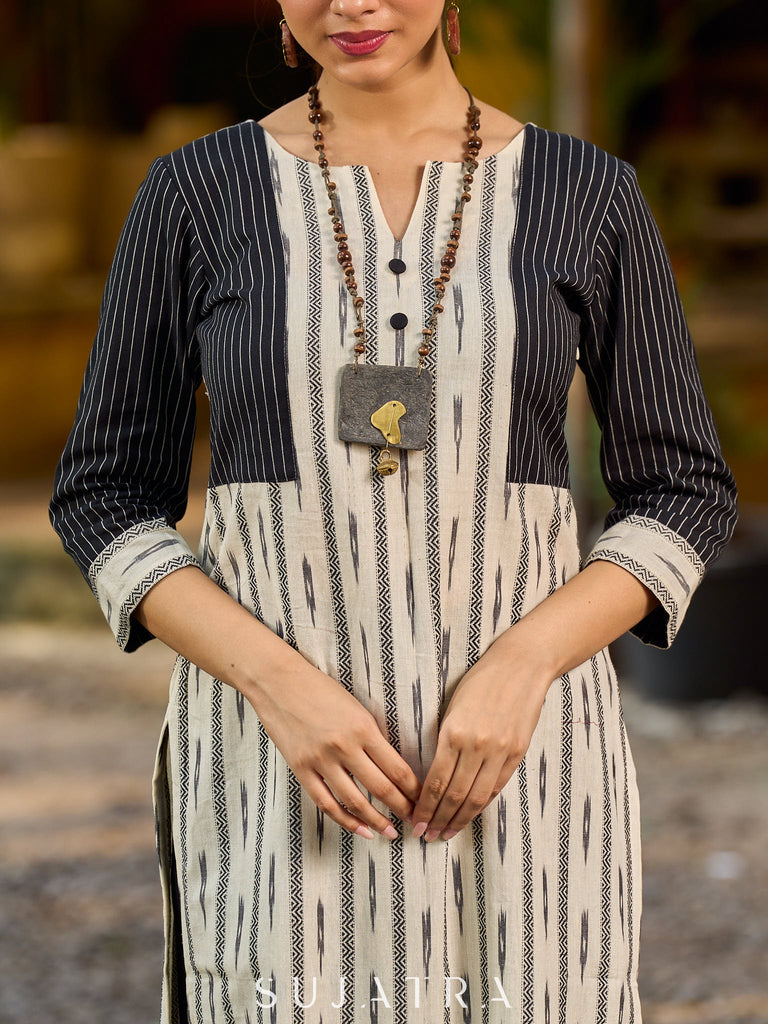 Timeless monochrome Ikat kurta enhanced with stripe details.