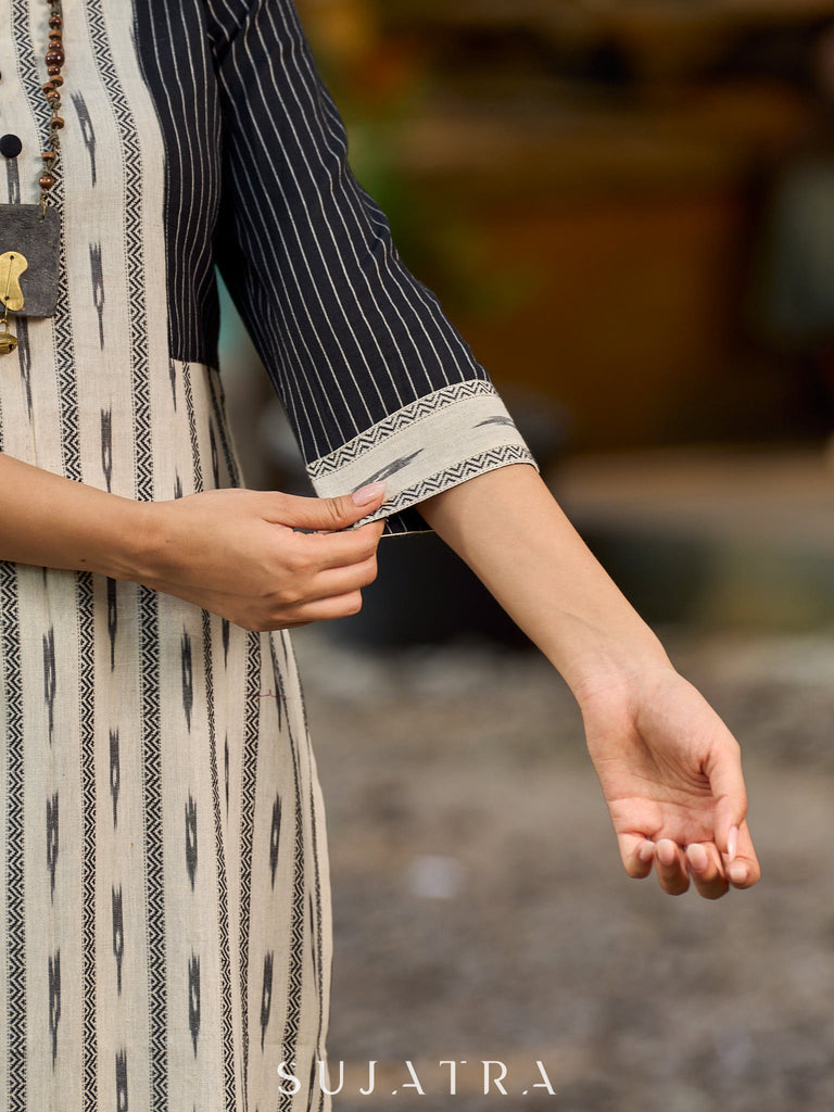 Timeless monochrome Ikat kurta enhanced with stripe details.