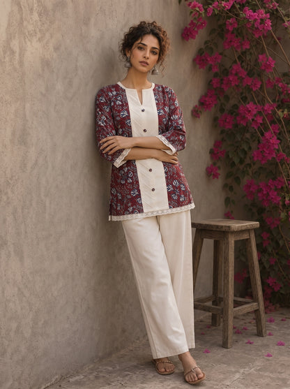 Deep red Jaipur floral printed top featuring maroon pintuck yoke, off-white panel, and scalloped lace detailing.