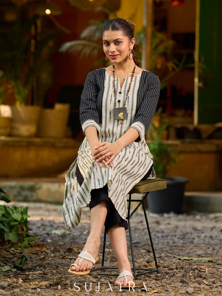 Timeless monochrome Ikat kurta enhanced with stripe details.