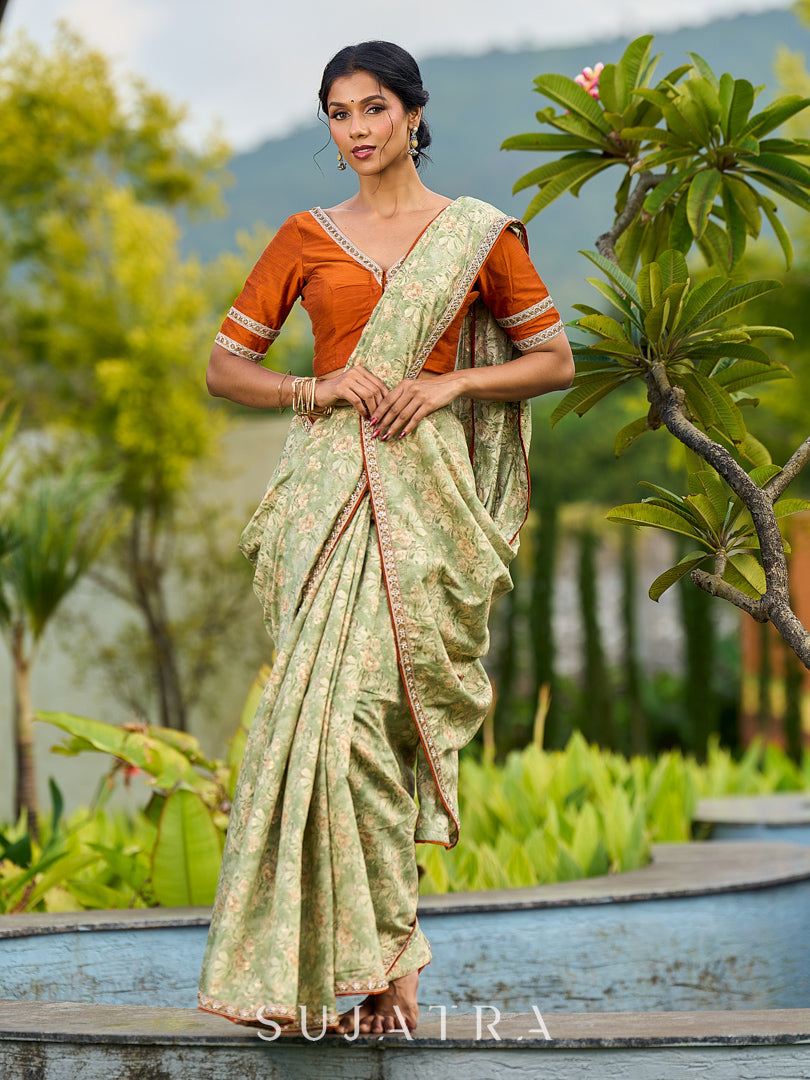Enchanting Sage Green Saree with All-Over Foil Floral Print & Golden-Orange Trim Detail with Hand Embroidered Pallu