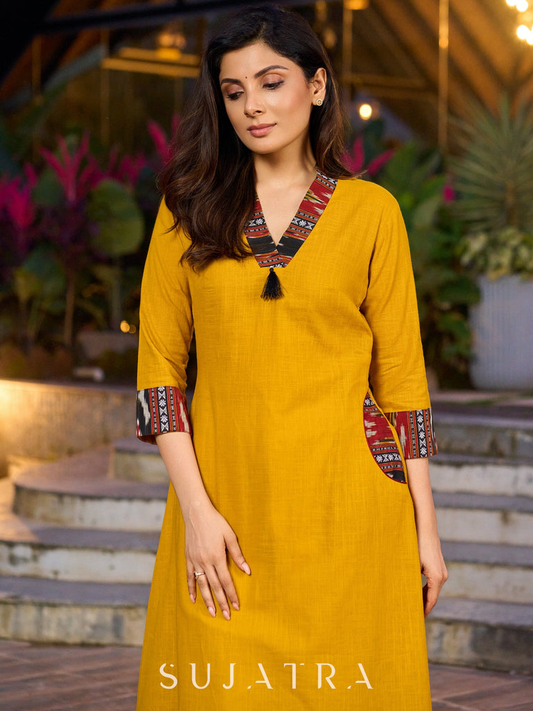 An elegant fusion of cotton comfort and vibrant Ikat charm kurta -white pant optional