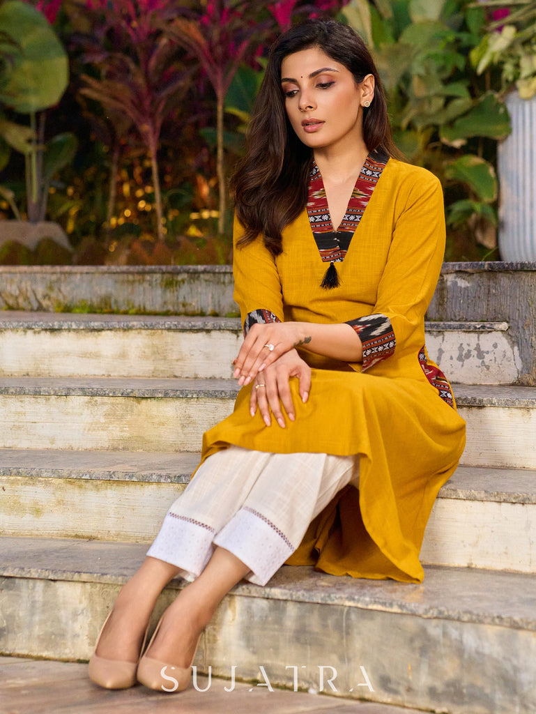 An elegant fusion of cotton comfort and vibrant Ikat charm kurta -white pant optional