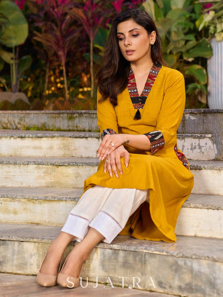 An elegant fusion of cotton comfort and vibrant Ikat charm kurta -white pant optional