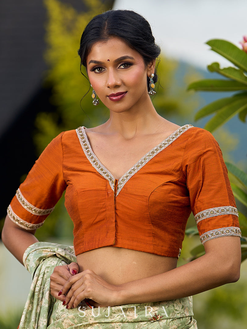 Enchanting Sage Green Saree with All-Over Foil Floral Print & Golden-Orange Trim Detail with Hand Embroidered Pallu