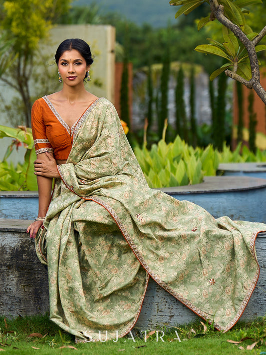 Enchanting Sage Green Saree with All-Over Foil Floral Print & Golden-Orange Trim Detail with Hand Embroidered Pallu