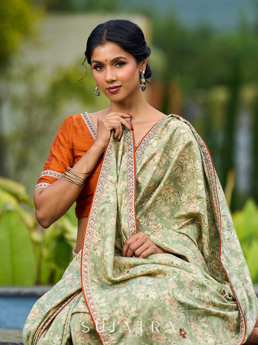 Enchanting Sage Green Saree with All-Over Foil Floral Print & Golden-Orange Trim Detail with Hand Embroidered Pallu