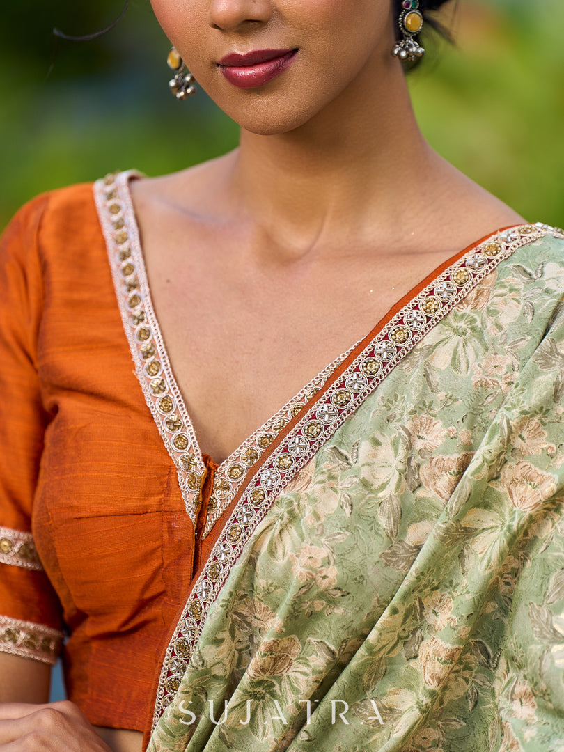 Enchanting Sage Green Saree with All-Over Foil Floral Print & Golden-Orange Trim Detail with Hand Embroidered Pallu