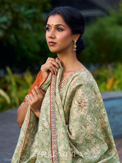 Enchanting Sage Green Saree with All-Over Foil Floral Print & Golden-Orange Trim Detail with Hand Embroidered Pallu