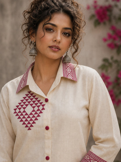 Vibrant ivory hand block print shirt featuring geometric motifs, magenta accents, and a contemporary silhouette inspired by traditional craftsmanship.