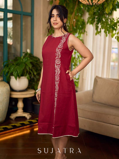 Maroon block printed sleeveless dress with hand block printed floral side panel, off-white accents, and pearl embellishments for a refined, elegant look.