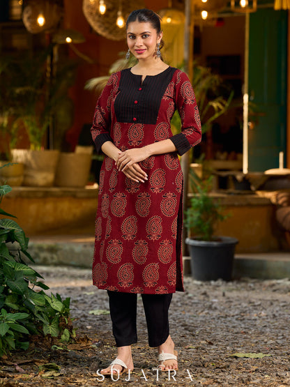 Stunning maroon Ajrakh kurta with an artisanal black pintuck patch.