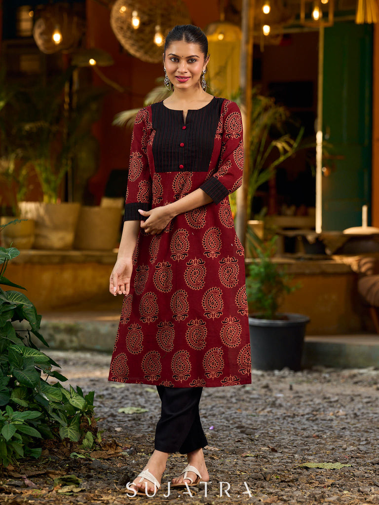 Stunning maroon Ajrakh kurta with an artisanal black pintuck patch.
