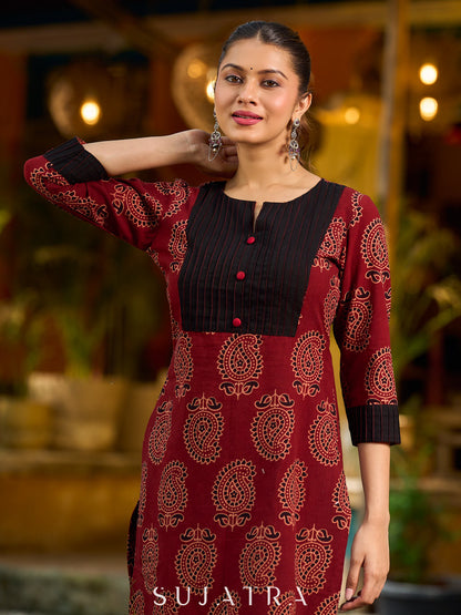 Stunning maroon Ajrakh kurta with an artisanal black pintuck patch.