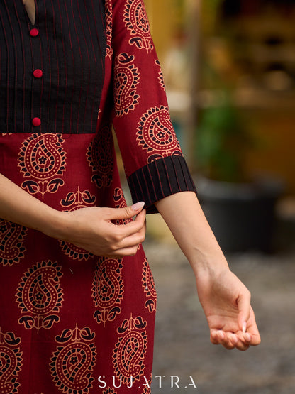 Stunning maroon Ajrakh kurta with an artisanal black pintuck patch.