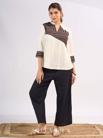 Cream Rayon Designer Top with Contrast Geometric Print Panel & Statement Pleats