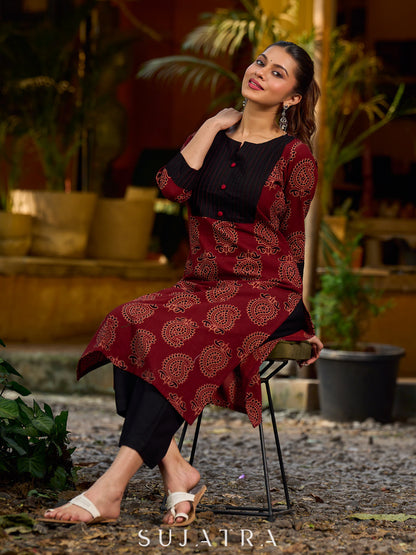 Stunning maroon Ajrakh kurta with an artisanal black pintuck patch.