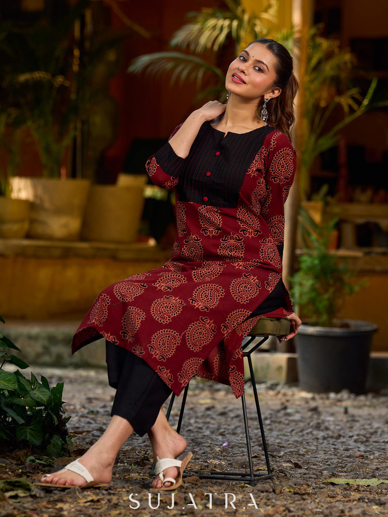 Stunning maroon Ajrakh kurta with an artisanal black pintuck patch.
