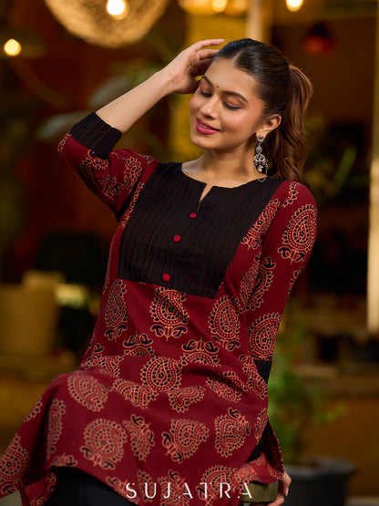 Stunning maroon Ajrakh kurta with an artisanal black pintuck patch.