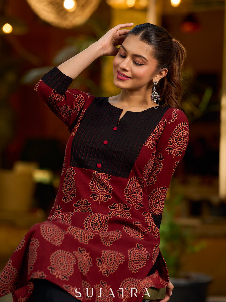 Stunning maroon Ajrakh kurta with an artisanal black pintuck patch.