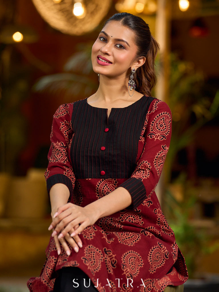 Stunning maroon Ajrakh kurta with an artisanal black pintuck patch.