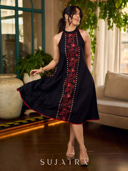 Black bias-cut block print halter dress with a red jaal hand block printed front panel, golden print detailing, and red accents for a striking, elegant statement look.