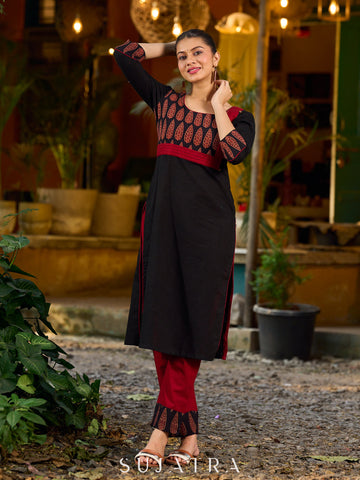 Elegant black kurta featuring an Ajrakh leaf patch across the neck panel