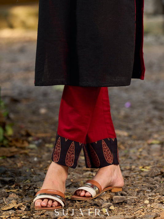 Stylish maroon pants elevated with a black Ajrakh leaf border.