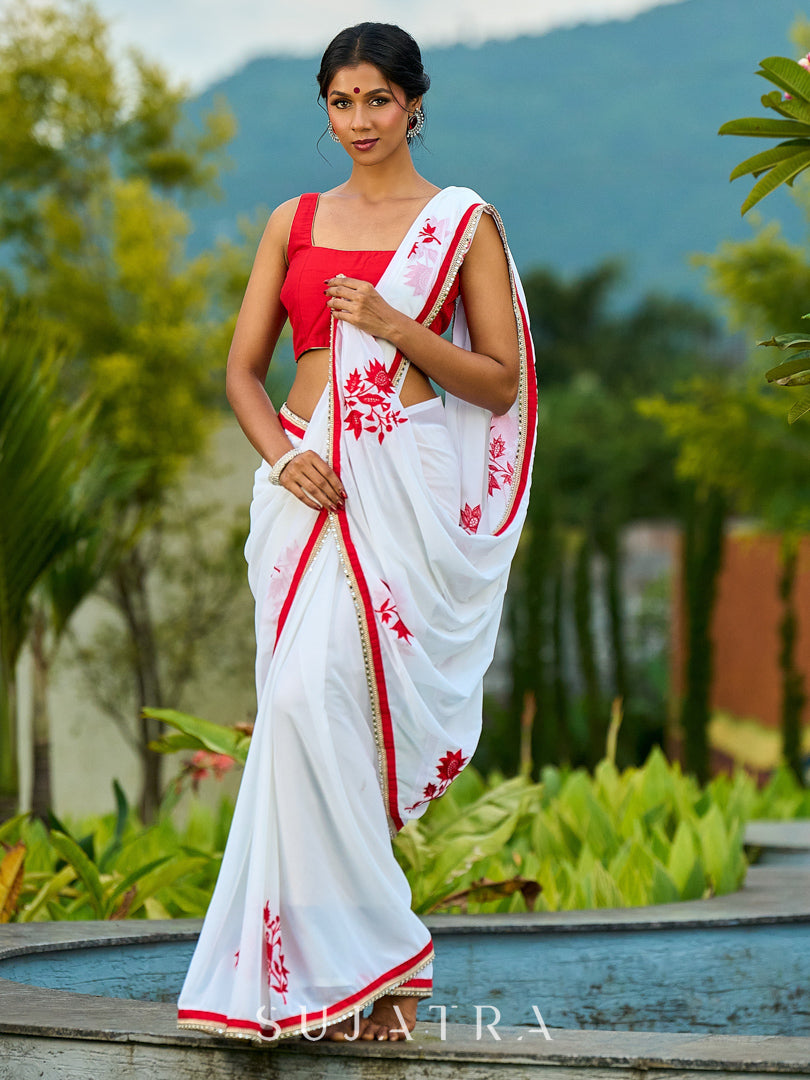 Artisanal White Georgette Saree with Red Embroidered Motifs & Beaded Border Trim
