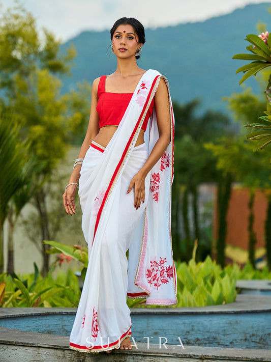 Artisanal White Georgette Saree with Red Embroidered Motifs & Beaded Border Trim