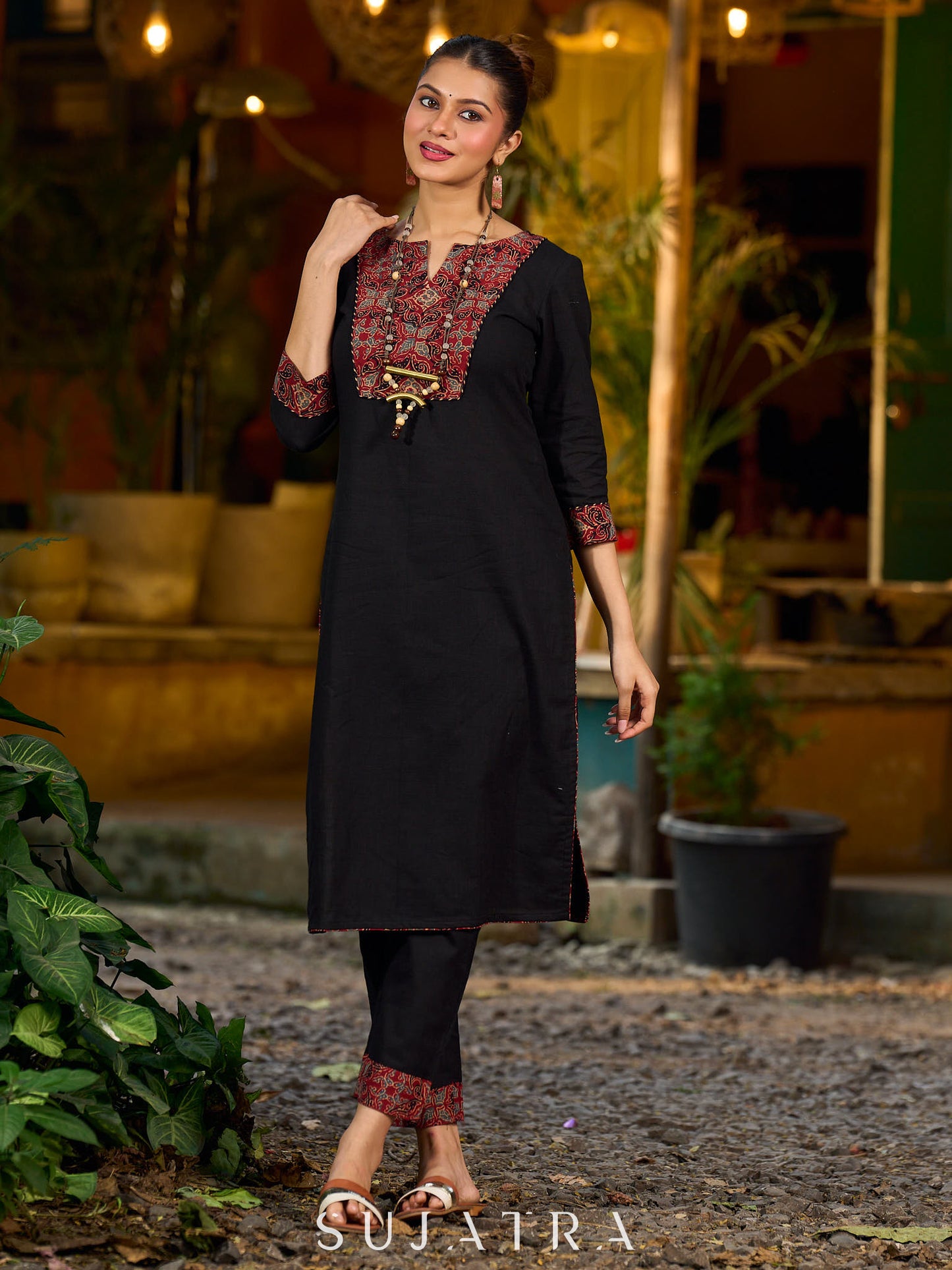 elegant black cotton kurta with beautifully crafted ajrakh panel and subtle stripe piping accents