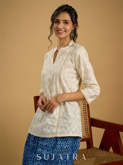 Classic off -white cotton top featuring delicate hakoba embroidery work.