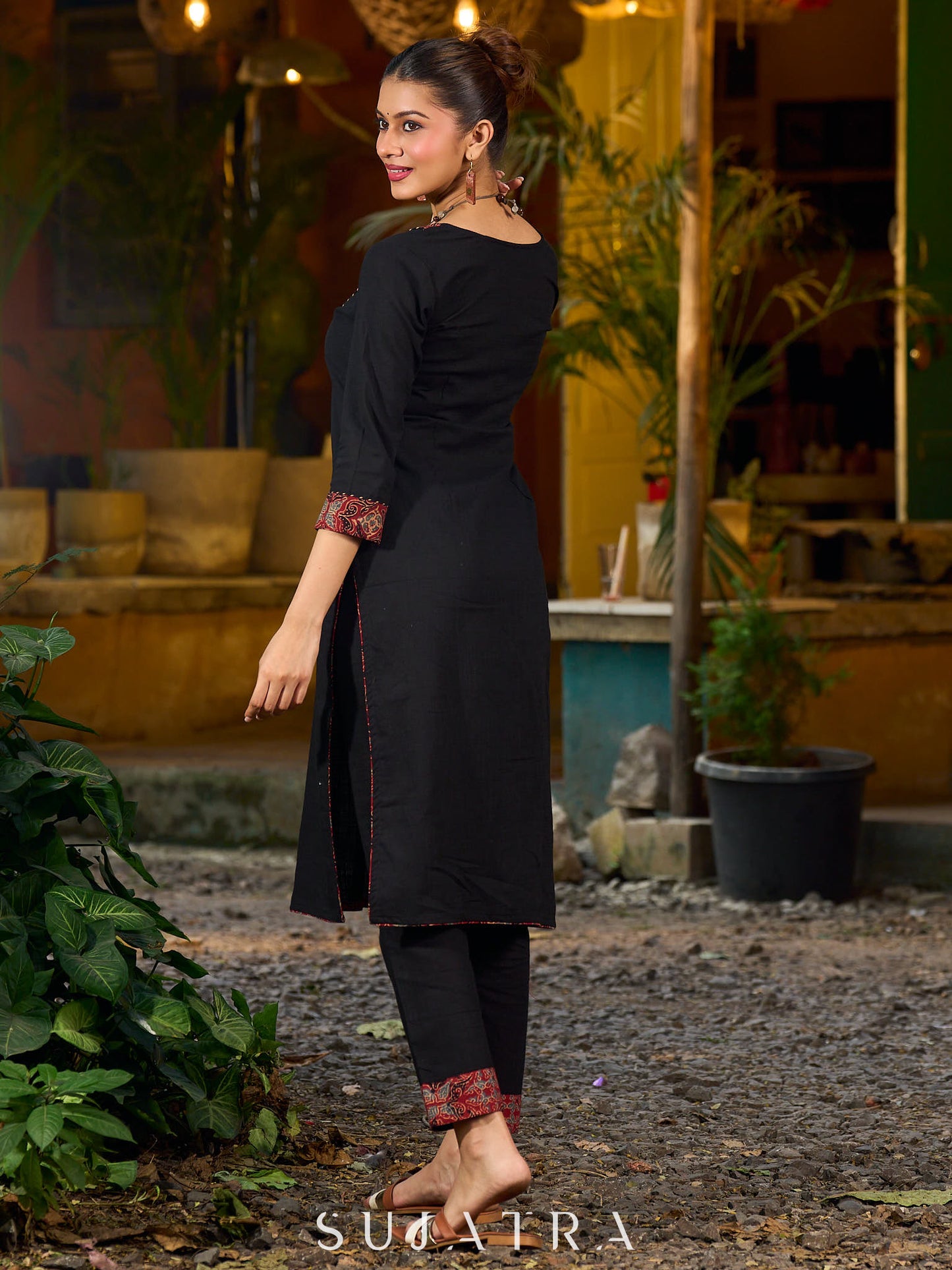 elegant black cotton kurta with beautifully crafted ajrakh panel and subtle stripe piping accents
