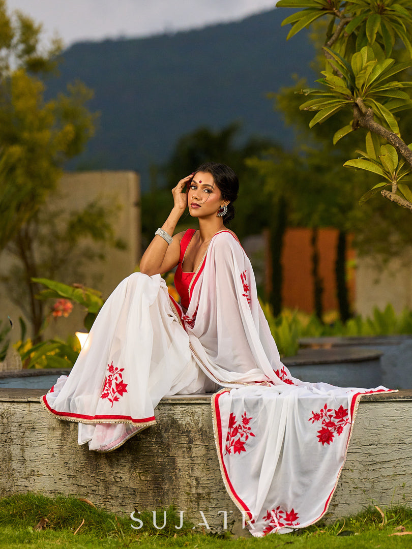 Artisanal White Georgette Saree with Red Embroidered Motifs & Beaded Border Trim