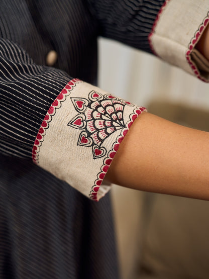 Timeless black stripes accented with exquisite hand-painted Madhubani on collars and cuffs