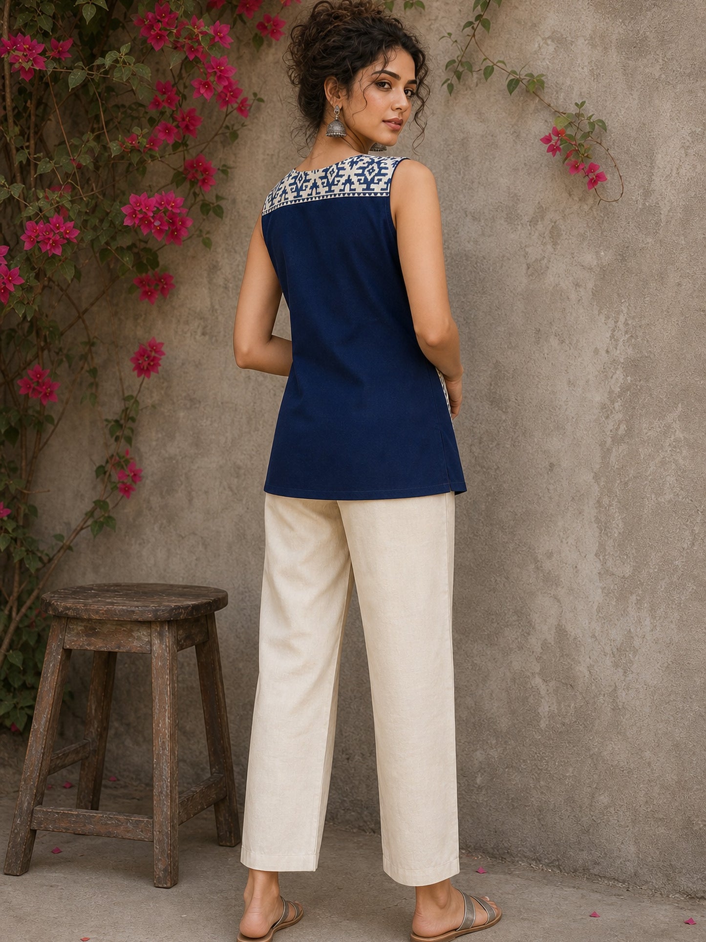 Contemporary off white and navy hand block print top featuring striking geometric motifs, an asymmetric layered silhouette, and effortless elegance
