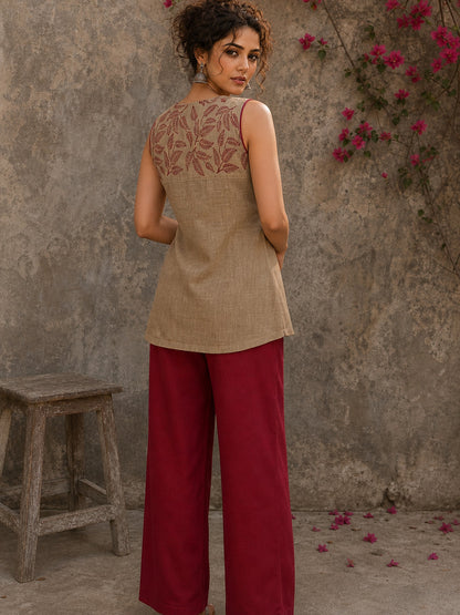 Sophisticated beige waist coat top showcasing refined leaf block print motifs, a polished button-down front, and elegant red piping for artisanal style.