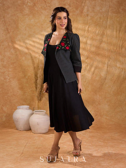 Exquisite black Ikat jacket with offset collar flaps and detailed red floral vine embroidery, delivering a sculpted, high-impact silhouette with refined presence for corporate styling.