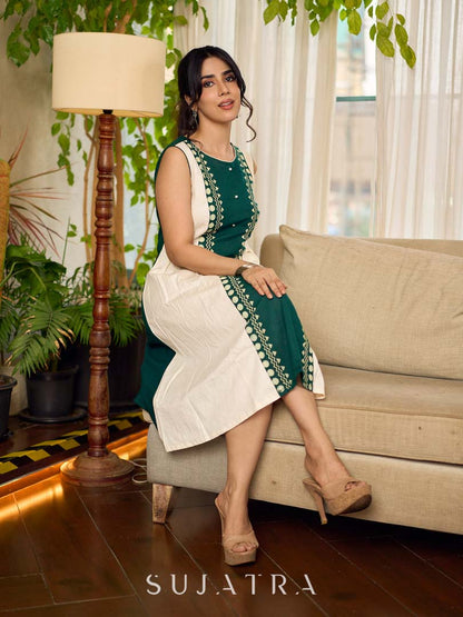 Bottle green and off-white hand block printed sleeveless dress with a block printed geometric panel, pearl embellishments, and refined accents for a contemporary artisanal look.