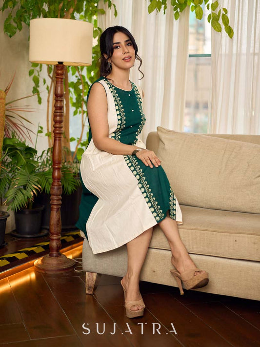 Bottle green and off-white hand block printed sleeveless dress with a block printed geometric panel, pearl embellishments, and refined accents for a contemporary artisanal look.