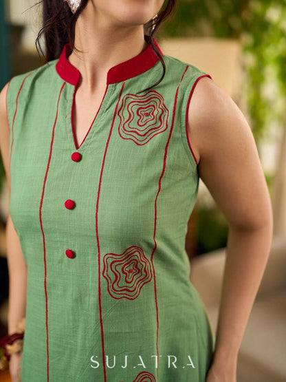 Pista sleeveless block printed dress with red abstract motif panels, a contrasting red collar, and accents for a fresh, artisanal, contemporary look.